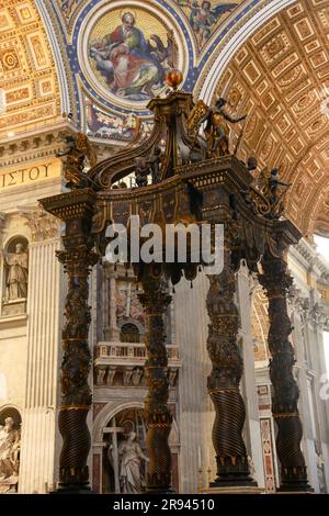 Golden historical interiors of Saint Peter's Basilica with Bernini Tower, in the Vatican city in Rome, Italy Stock Photo