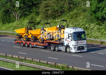 LOGISTICA Brit European Group 2023 Renault Truck T with step-frame trailer carrying new JCB 6T-2, 6 tonnes Site Dumper trucks; travelling on the M6 motorway in Greater Manchester, UK Stock Photo