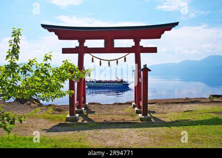 Lake Tazawa and Torii Gate of Ozaishi Shrine Stock Photo