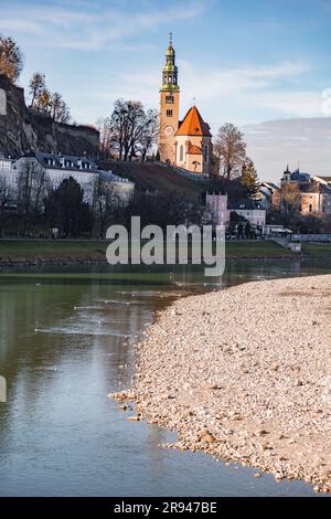 Salzburg, Austria - December 27, 2021: Buildings around Salzach river near the old town, Altstadt Salzburg, Austria. Stock Photo