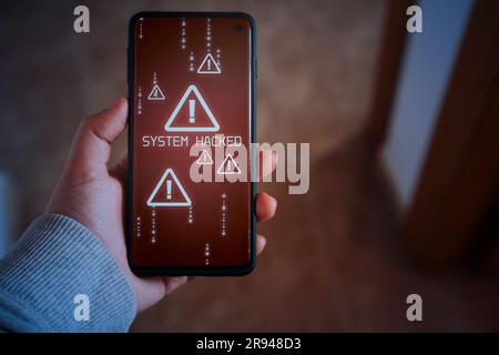 Woman shows smartphone with system hacked alert on screen. Compromised information concept. Internet virus cyber security and cybercrime. Stock Photo