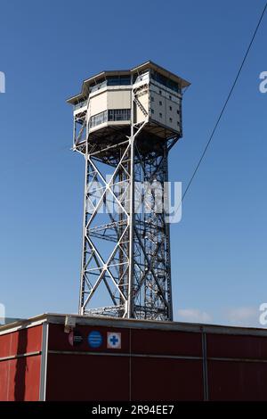 Barcelona, Spain - FEB 10, 2022: Torre Sant Sebastia is a 78 metre tall free standing lattice tower in Barcelona, Catalonia, Spain which is used as a Stock Photo