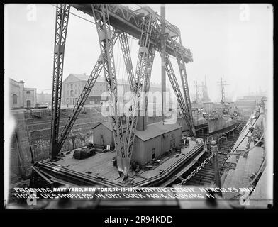 Floating Crane Hercules and Three Destroyers in Dry Dock Number 4 Looking North. Glass Plate Negatives of the Construction and Repair of Buildings, Facilities, and Vessels at the New York Navy Yard. Stock Photo