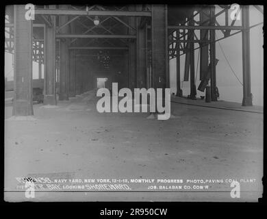 Monthly Progress Photo, Paving Coal Plant Pier, Center Bay, Looking Shoreward, Joseph Balaban Company, Contractor. Glass Plate Negatives of the Construction and Repair of Buildings, Facilities, and Vessels at the New York Navy Yard. Stock Photo