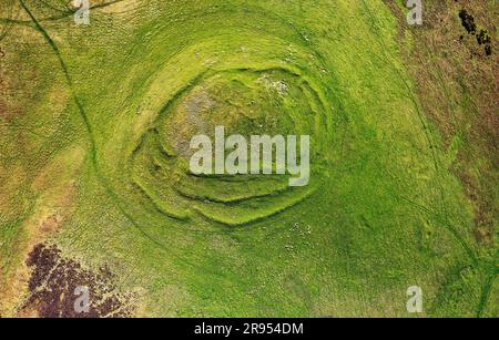 Cockburn Law late prehistoric hill fort near Duns in the borders region, Scotland. Aerial showing 3 earth and stone ramparts and 2 staggered entrances Stock Photo