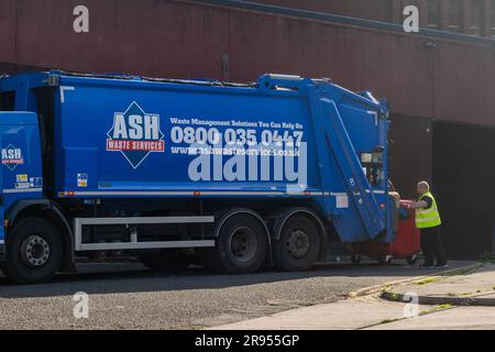 Bin men emptying commercial bins in Chester, Cheshire, UK. Stock Photo