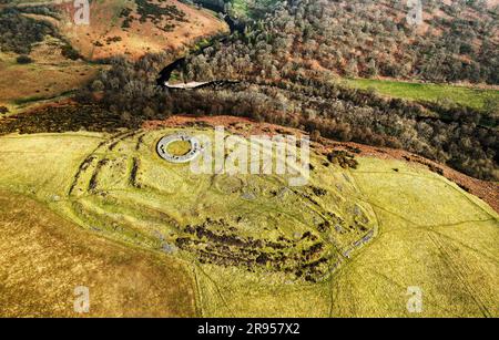Edins Hall Hillfort and Broch above Whiteadder Water. Scotland. Circular stone footings of 2nd C broch within earlier Iron Age hillfort. Aerial from S Stock Photo