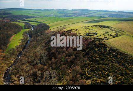 Edins Hall Hillfort and Broch above Whiteadder Water. Scotland. Circular stone footings of 2nd C broch within earlier Iron Age hillfort. Aerial from E Stock Photo