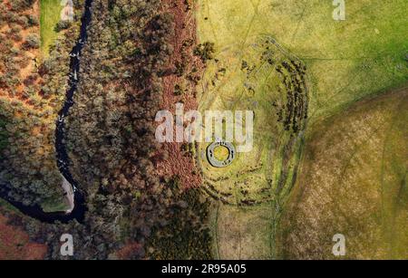 Edins Hall Hillfort and Broch above Whiteadder Water. Scotland. Circular stone footings of 2nd C broch within earlier Iron Age hillfort. Aerial Stock Photo