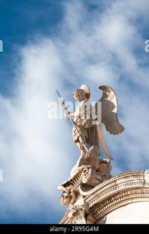 Sibenik, Croatia - May 31, 2023: Stone statue of St Michael killing the Satan , on the top of St Jacobs cathedral in Sibenik, Croatia Stock Photo