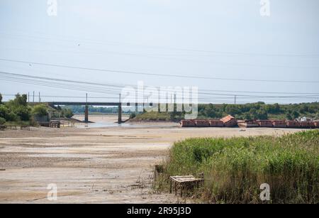 Terrible Disaster Ecocide landscape of dried up Kakhovka Reservoir with Hopper barges on the 'bottom' in Zaporizhzhia region as a result of Kakhovka D Stock Photo