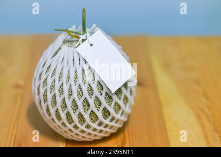 melon on wood background for sale Stock Photo