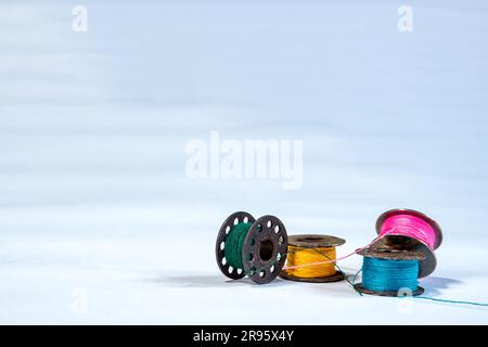 Threads for sewing of various colors on a white background isola Stock  Photo by ©avtor_hell 144177959