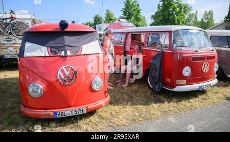 Hanover, Germany. 24th June, 2023. Volkswagen Bullis stand at the VW Bus Festival at the Hanover Exhibition Grounds. The festival has attracted thousands of Bulli fans to the Hanover fairgrounds since Friday. Until Sunday, different generations of the cult vehicle are shown. Credit: Julian Stratenschulte/dpa/Alamy Live News Stock Photo