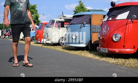 Hanover, Germany. 24th June, 2023. Volkswagen Bullis stand at the VW Bus Festival at the Hanover Exhibition Grounds. The festival has attracted thousands of Bulli fans to the Hanover fairgrounds since Friday. Until Sunday, different generations of the cult vehicle are shown. Credit: Julian Stratenschulte/dpa/Alamy Live News Stock Photo