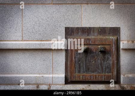 The after hours depository door on the wall of an old bank in downtown El Paso, Texas. Stock Photo
