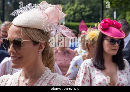 Ascot, UK. 24th June, 2023. Racegoers arrive for the fifth day of Royal Ascot. Each Royal Ascot enclosure has a different Dress Code, with the strictest applying to the Royal Enclosure, but a few restrictions apply to all enclosures. Credit: Mark Kerrison/Alamy Live News Stock Photo