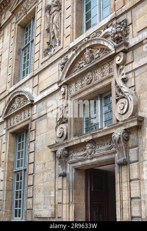 Facade of an old Parisian stoned mansion Hotel de Sully Stock Photo