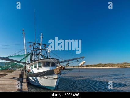 Shrimp boat at Colorado River wharf near its mouth into Gulf of Mexico, near Matagorda, Texas, USA Stock Photo