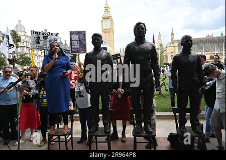 London, UK. 24th June, 2023. Apsana Begum addresses supporters of her husband, jailed Wikileaks founder Julian Assange at a rally in Parliament Square demanding his release. The Real Statue Of Liberty of Edward Snowden, Julian Assange and Chelsea Manning display in Parliament square. Credit: See Li/Picture Capital/Alamy Live News Stock Photo