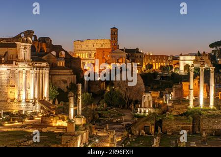 View over the ruins of the Foro Romanum in Rome at dawn with the Colosseum in the background Stock Photo