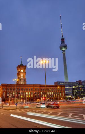The town hall and the famous TV tower in Berlin at night with car traffic Stock Photo
