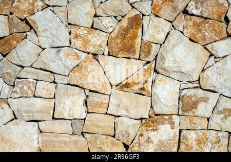 Background from a natural granite stone wall Stock Photo