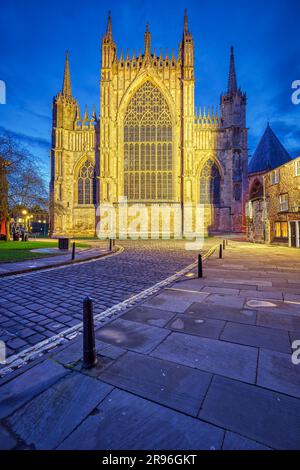 The back of York Minster and some half-timbered houses at dusk Stock Photo