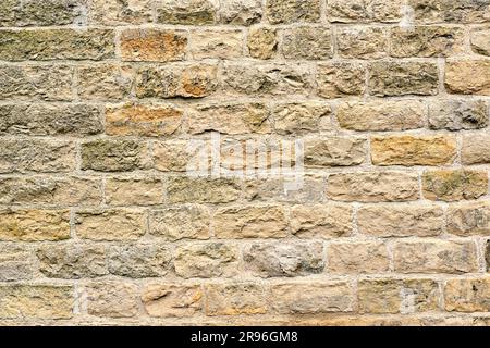 Background from a beige natural stone wall Stock Photo