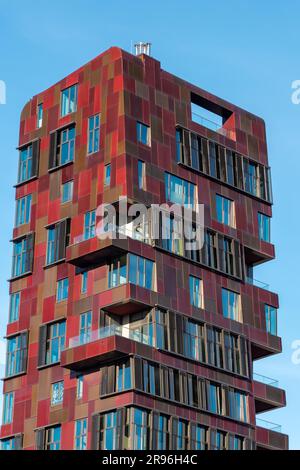 Modern red high-rise residential building in the Hafencity in Hamburg, Germany Stock Photo