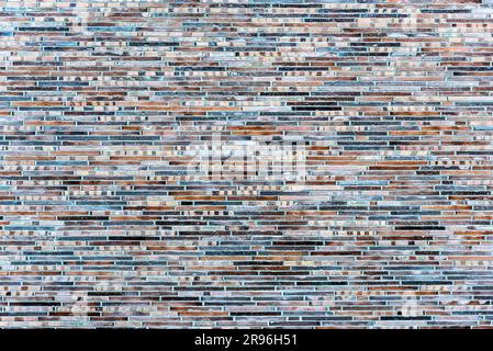 Background made of a wall of small clinker bricks Stock Photo