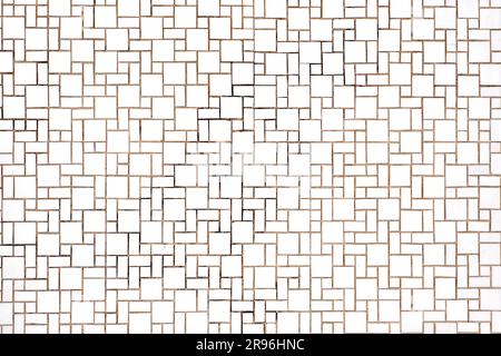 Background made of a wall of rectangular and square white mosaic tiles Stock Photo