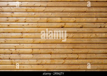 Background made of a wall of painted brown wooden boards Stock Photo