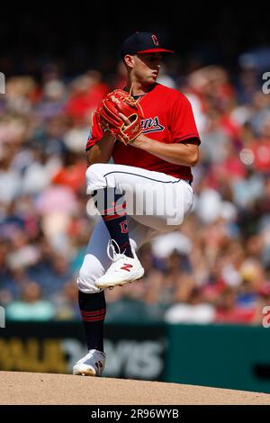 Cleveland Guardians starting pitcher Tanner Bibee (61) inspects a ball ...