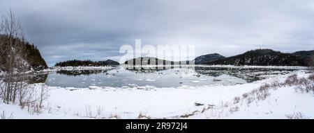 A panoramic view of a winter landscape along the shores of the St. Lawrence River in Canada. Stock Photo