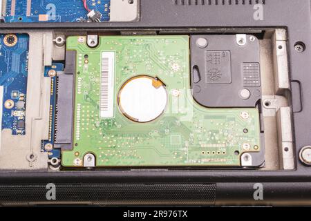 cyber data attack concept : broken laptop ,crash motherboard ,memory hard disk electronic hardware problems on white desktop ,backup information maint Stock Photo