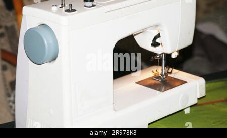 sewing machine and item of clothing Stock Photo