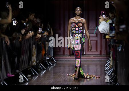 Pharrell Williams Wears Boot Pants at Loewe's Spring 2024 Men's Show –  Footwear News