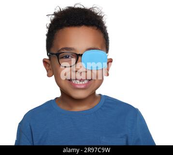 African American boy with eye patch on glasses against white background. Strabismus treatment Stock Photo