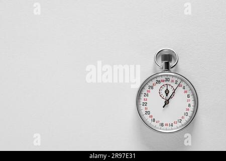 Vintage timer on light grey background, top view with space for text. Measuring tool Stock Photo