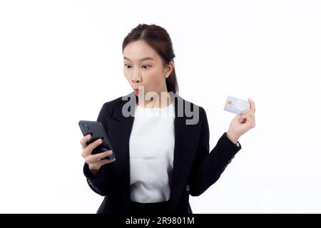Portrait young asian business woman hold credit card and looking smart phone for shopping online isolated white background, businesswoman looking debi Stock Photo