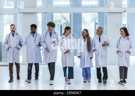 Group of experienced doctors from different of filed working together as primary healthcare team to give medical diagnosis, treatment to patients. Dev Stock Photo