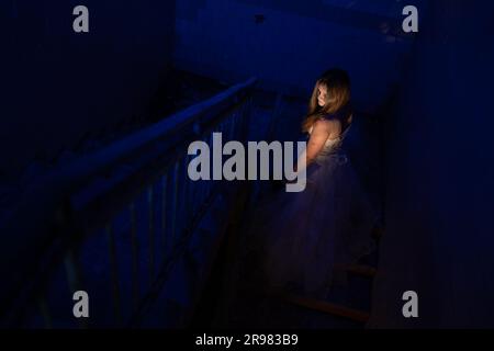 Scary ghost halloween theme, horror woman in white dress with long hair in haunted house. Halloween scary concept. Stock Photo