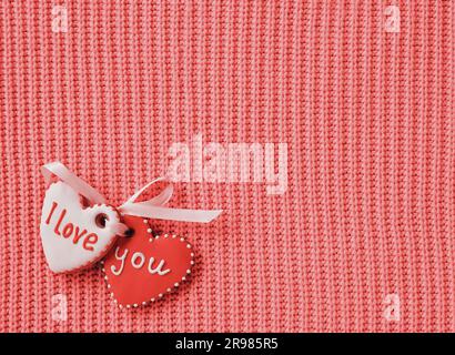I love you inscription on Gingerbreads. Red background Handmade Knitted Craft Stock Photo