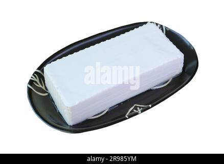 A Fresh Tofu Bean Curd on Black Plate Isolated on White Background Stock Photo