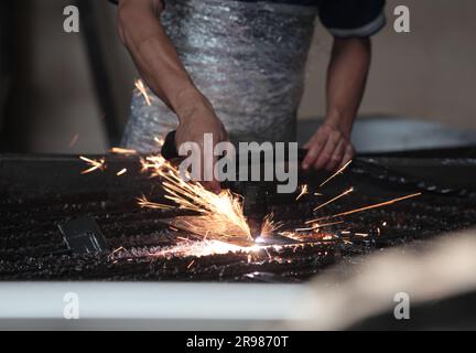 Cutting metal plate with a laser. cutting metal Stock Photo