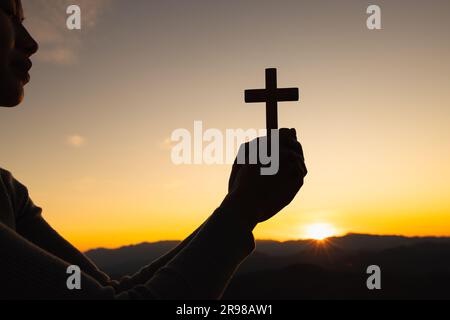 Religious young woman praying to God in the morning, spirtuality and religion, Religious concepts Stock Photo