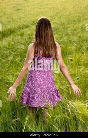 Girl in golden dress on fur Stock Photo - Alamy