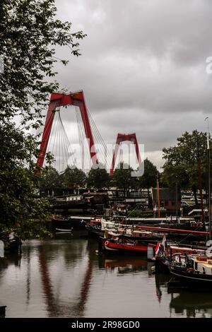 Rotterdam, NL - October 6, 2021: The Willemsbrug bridge with a total span of 318 meters connects the northern section of Rotterdam with the southern p Stock Photo