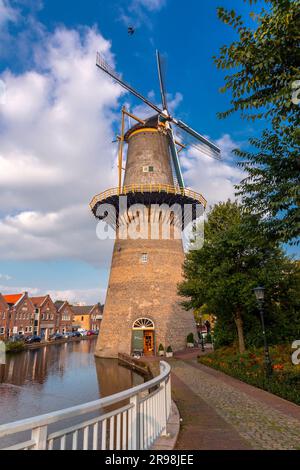 Schiedam, NL - OCT 8, 2021: De Noord is a windmill located on the Noordvest 38 in Schiedam, Netherlands. The tallest windmill in the world with a roof Stock Photo